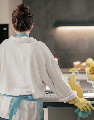 housework woman looking busy while cleaning kitchen